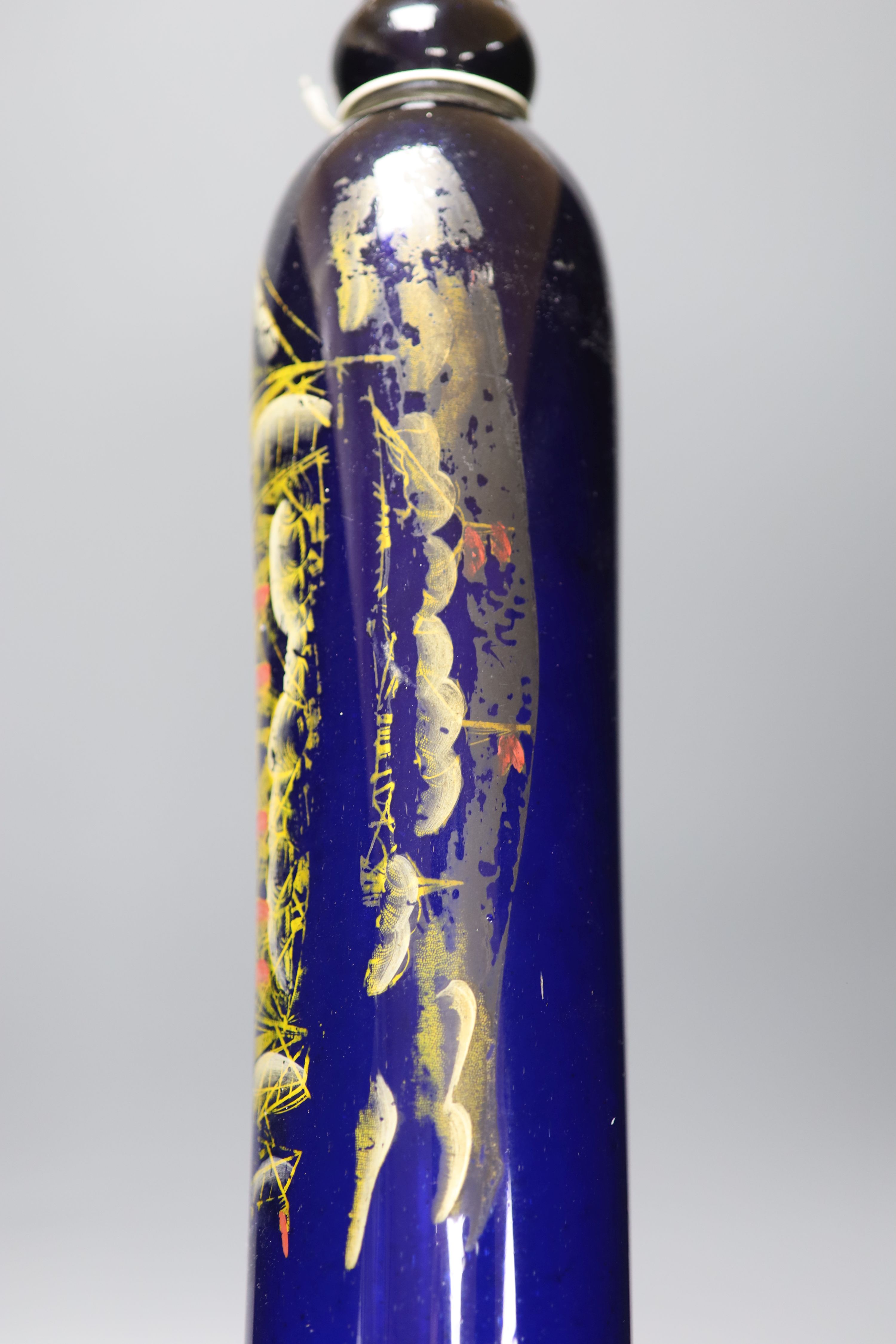 A large 9th century painted glass rolling pin, length 71cm